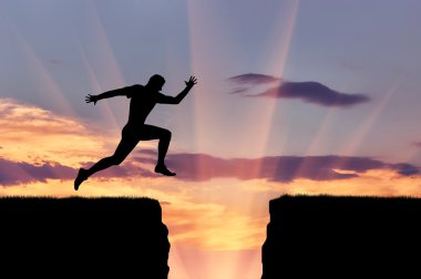 Runner atlet bir uçurumun atlar