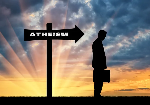 Man is an atheist in the direction where the sign shows atheism — Stock Photo, Image