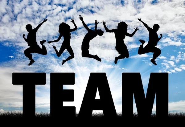 Silhouette Menschen springen über das Wort Team — Stockfoto