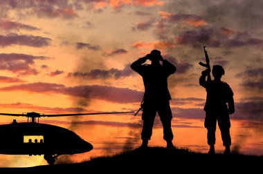 Bir askerin siluet ve helikopter