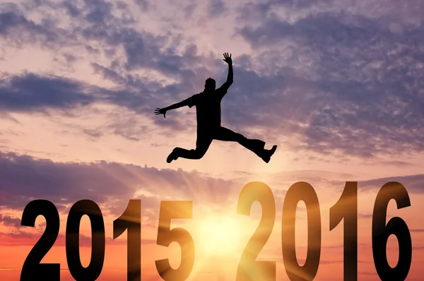 Man in a jump between 2015 and 2016 years