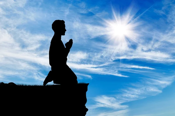 Silueta člověka modlit — Stock fotografie