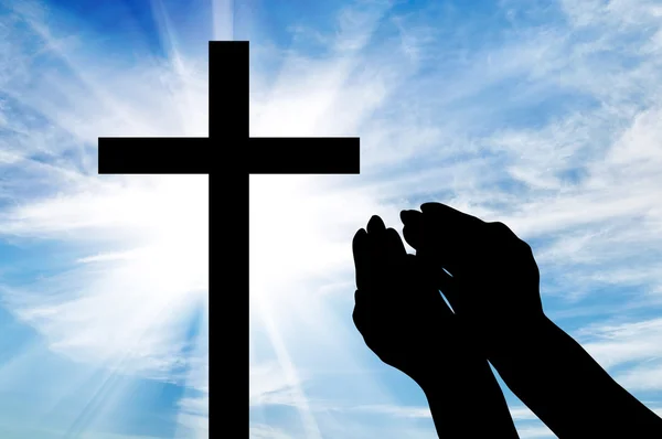 Silhouet van handen gestrekt op het Kruis — Stockfoto
