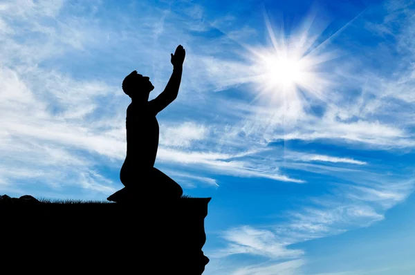 Silhouette of man praying — Stock Photo, Image