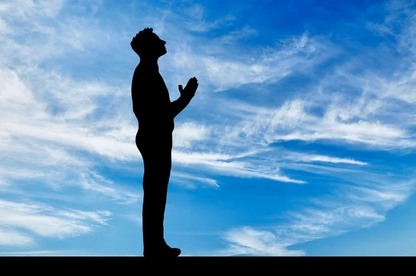 Silhouette of man praying — Stock Photo, Image