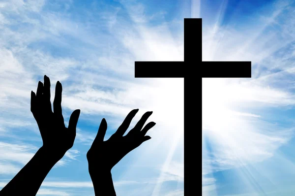 Silhouette of hands outstretched on the cross — Stock Photo, Image