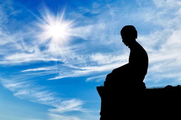 Silhouette of man praying