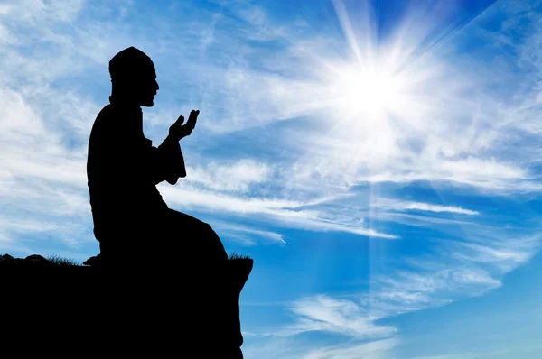 Silhouette of man praying — Stock Photo, Image