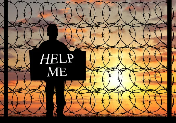 Silueta uprchlíků se plakát s žádostí o pomoc — Stock fotografie