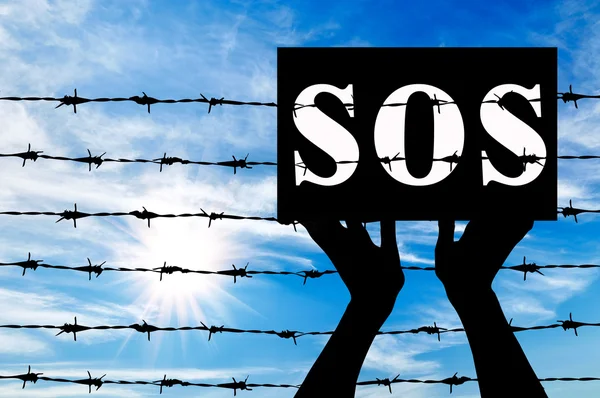 Refugiados y póster con la inscripción SOS — Foto de Stock