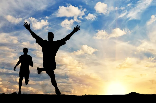 Silhouette of two men running competition — Stock Photo, Image