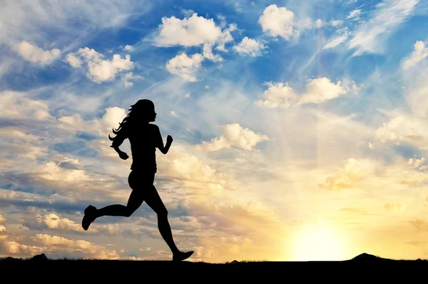 Silhouette of a girl running — Stock Photo, Image