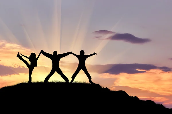 Silueta de tres personas felices — Foto de Stock