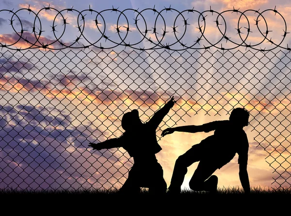 Silhouet van vluchtelingen grens de — Stockfoto