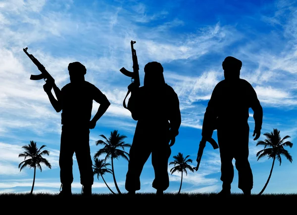 Silhouette av tre terrorister – stockfoto