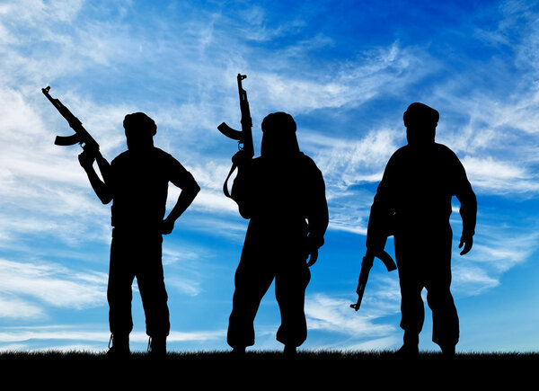 Silhouette of three terrorists