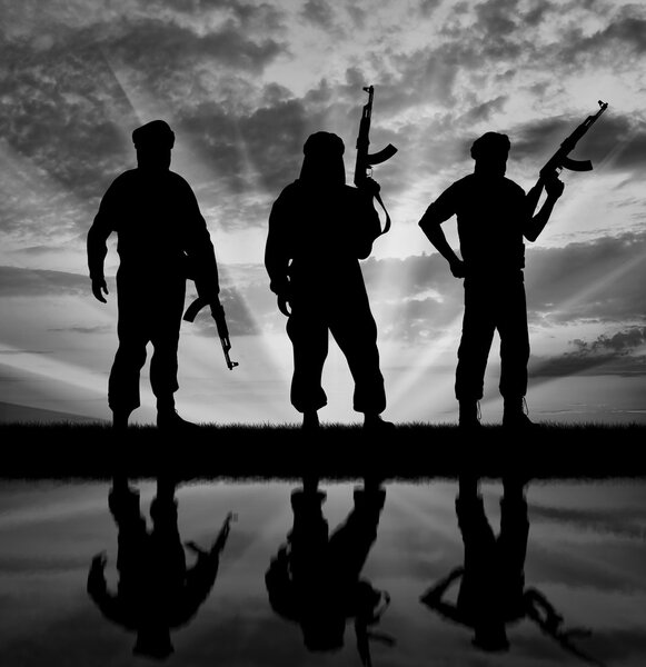 Silhouette of three terrorists 