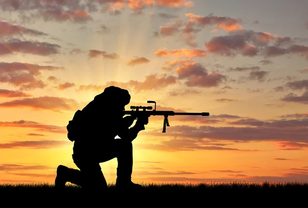 Silhouette of a terrorist with a rifle — Stock Photo, Image