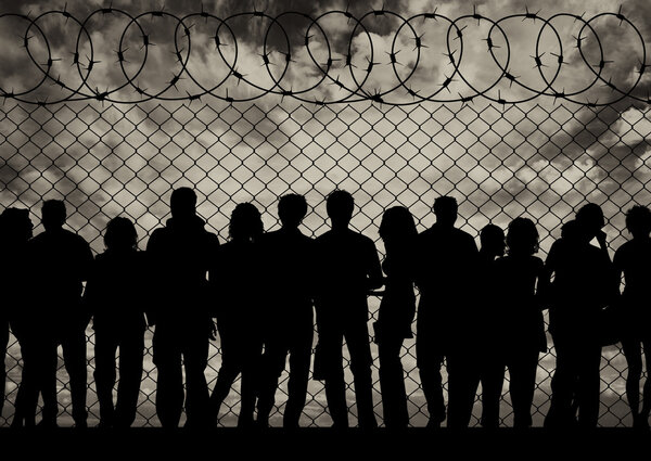 Silhouette of a crowd of refugees