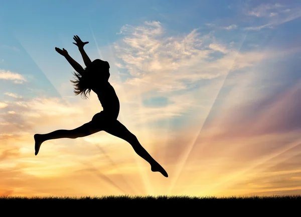 Silhouette of happy woman jumping — Stock Photo, Image