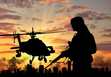 Siluet bir terörist ve bir helikopter 