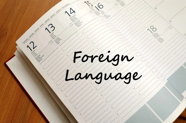 Foreign language write on notebook — Stock Photo, Image