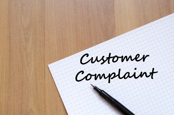 Customer complaint write on notebook — Stock Photo, Image
