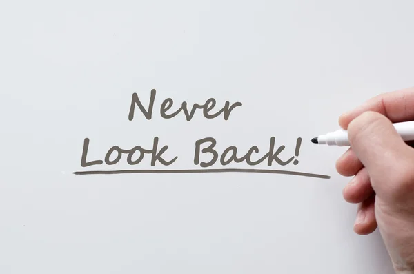 Never look back written on whiteboard — Stock Photo, Image
