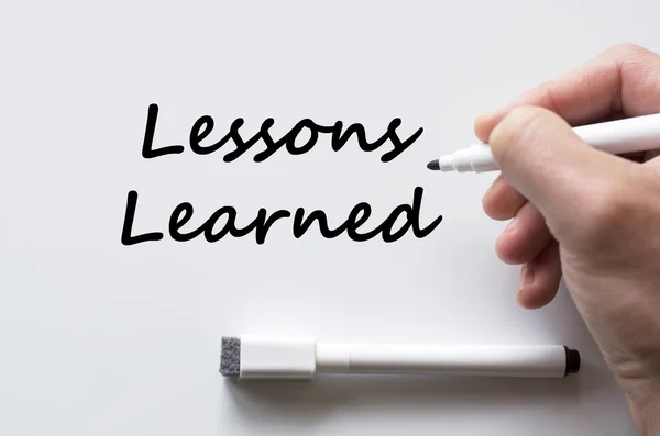 Lessons learned written on whiteboard — Stock Photo, Image