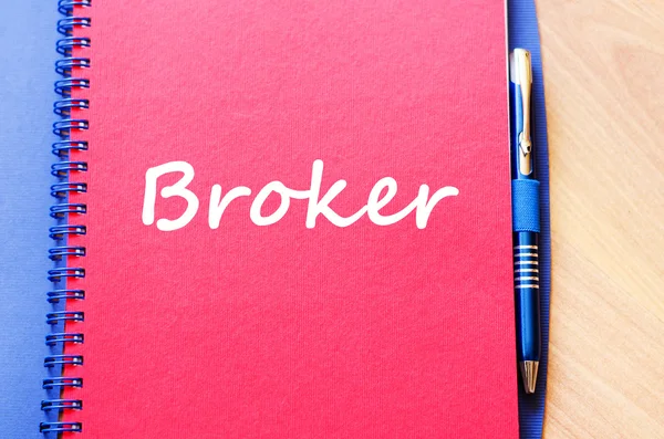 Broker write on notebook — Stock Photo, Image