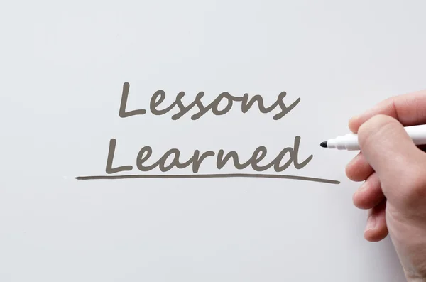 Lessons learned written on whiteboard — Stock Photo, Image