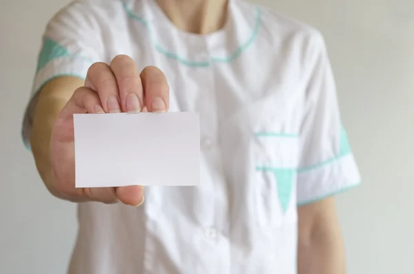 Doctor's hand holding blank business card — Stock Photo, Image