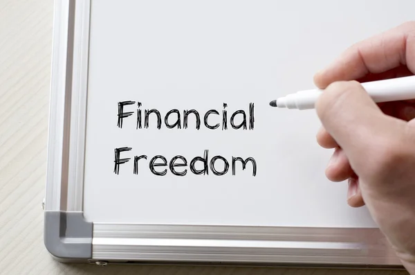 Financial freedom written on whiteboard — Stock Photo, Image