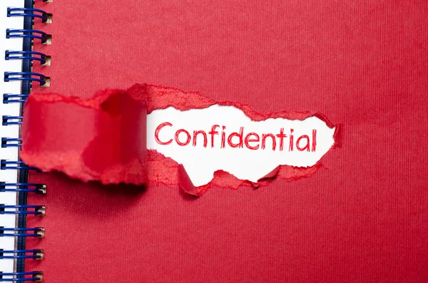 The word confidential appearing behind torn paper. — Stock Photo, Image