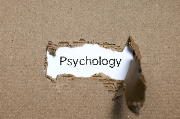 The word psychology appearing behind torn paper. — Stock Photo, Image