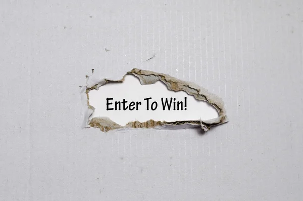 The word enter to win appearing behind torn paper — Stock Photo, Image