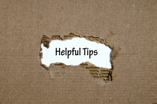 The word helpful tips appearing behind torn paper — Stock Photo, Image