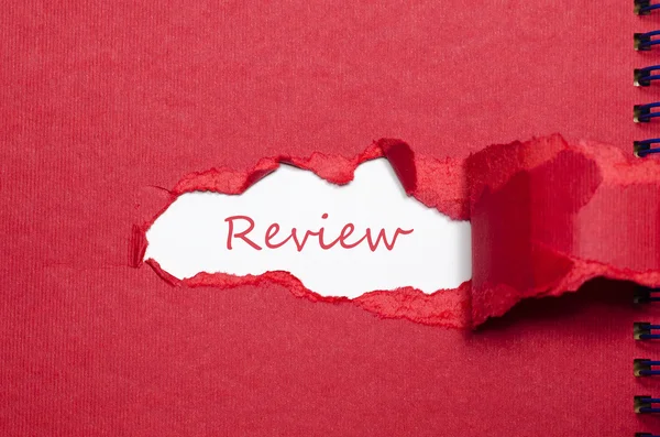 The word review appearing behind torn paper — Stock Photo, Image