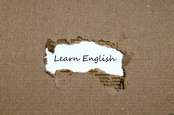 The word learn english appearing behind torn paper — Stock Photo, Image