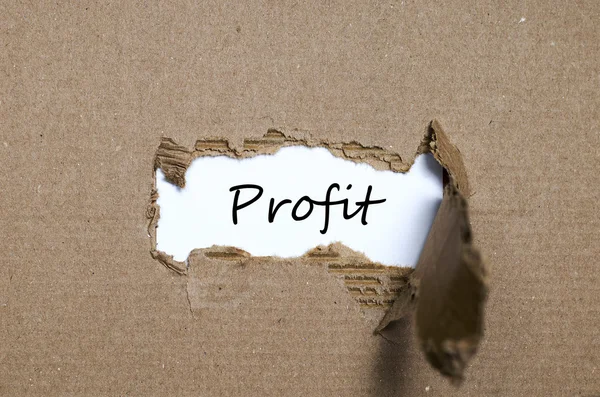 The word profit appearing behind torn paper — Stock Photo, Image