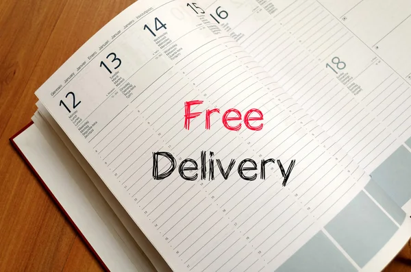 Free delivery text concept on notebook — Stock Photo, Image