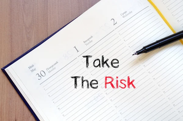 Take the risk text concept on notebook — Stock Photo, Image