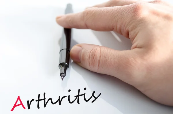 Pluma en la mano concepto de artritis — Foto de Stock