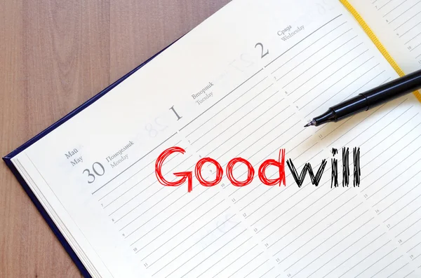 Goodwill skriva på anteckningsboken — Stockfoto
