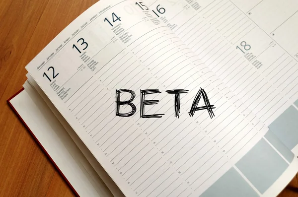 Beta write on notebook — Stock Photo, Image