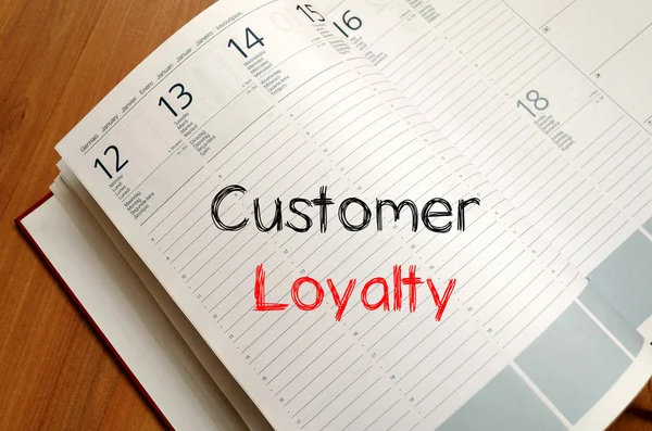 Customer loyalty write on notebook — Stock Photo, Image