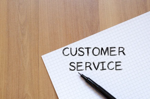 Customer service write on notebook — Stock Photo, Image