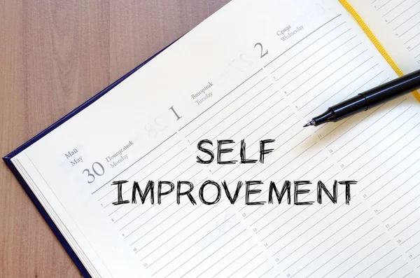 Self improvement write on notebook — Stock Photo, Image