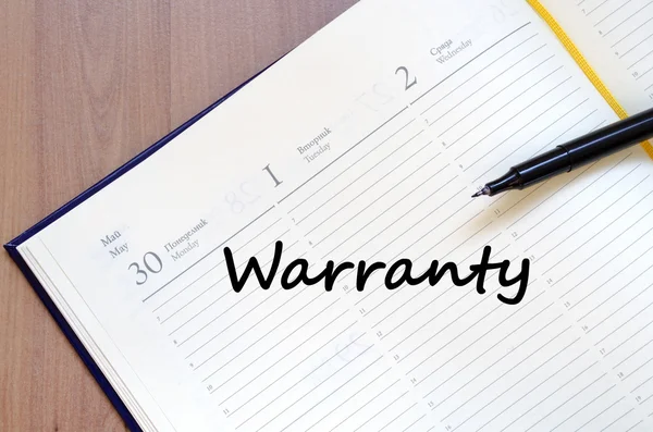 Warranty write on notebook — Stock Photo, Image