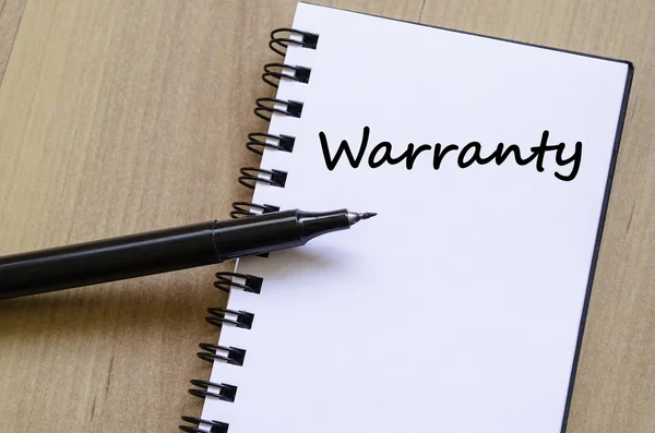 Warranty write on notebook — Stock Photo, Image